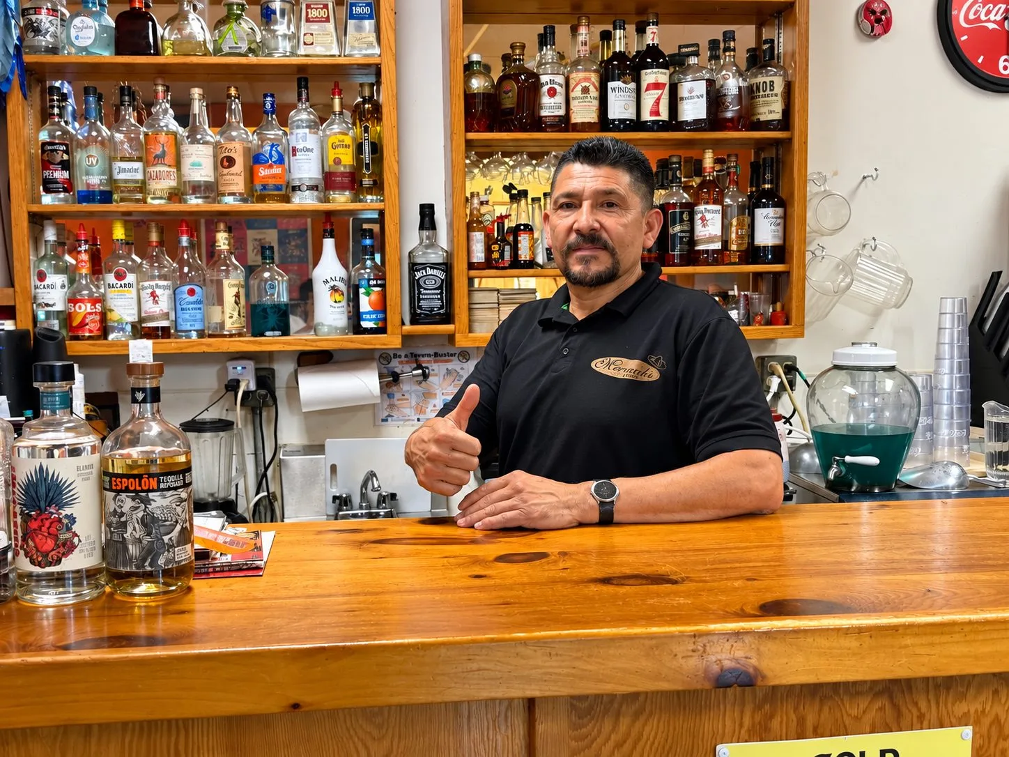 Eloy Cid, owner of Mariachi Fiesta, welcoming guests from behind the restaurant bar