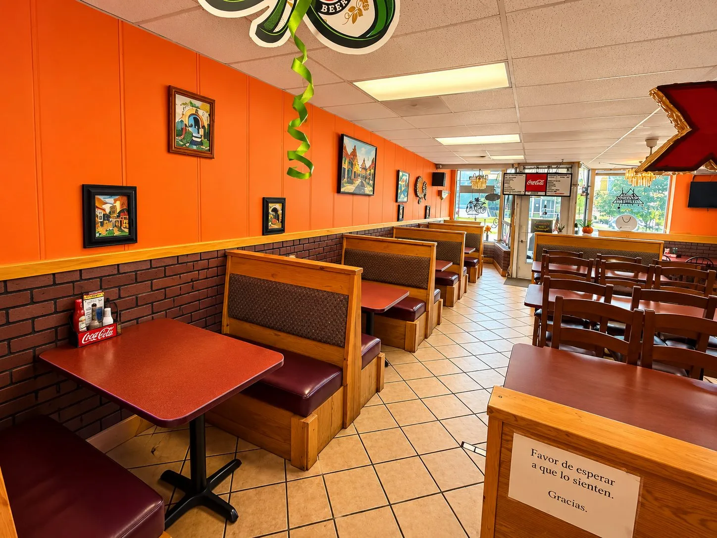 The colorful Mariachi Fiesta dining room with tables and wooden booths